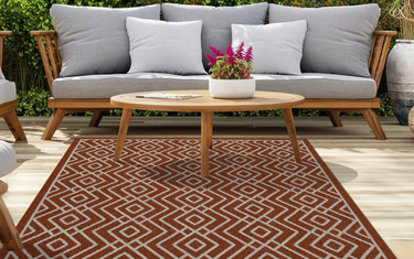 Best Styling Angle: How to Style a Terra Cream Diamond Outdoor Rug with Rattan & Wooden Furniture